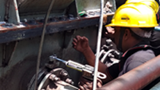 Two Indian men repairing a Transformer with PowerPatch