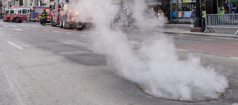 smoking manhole w firetrucks 800p x 353p